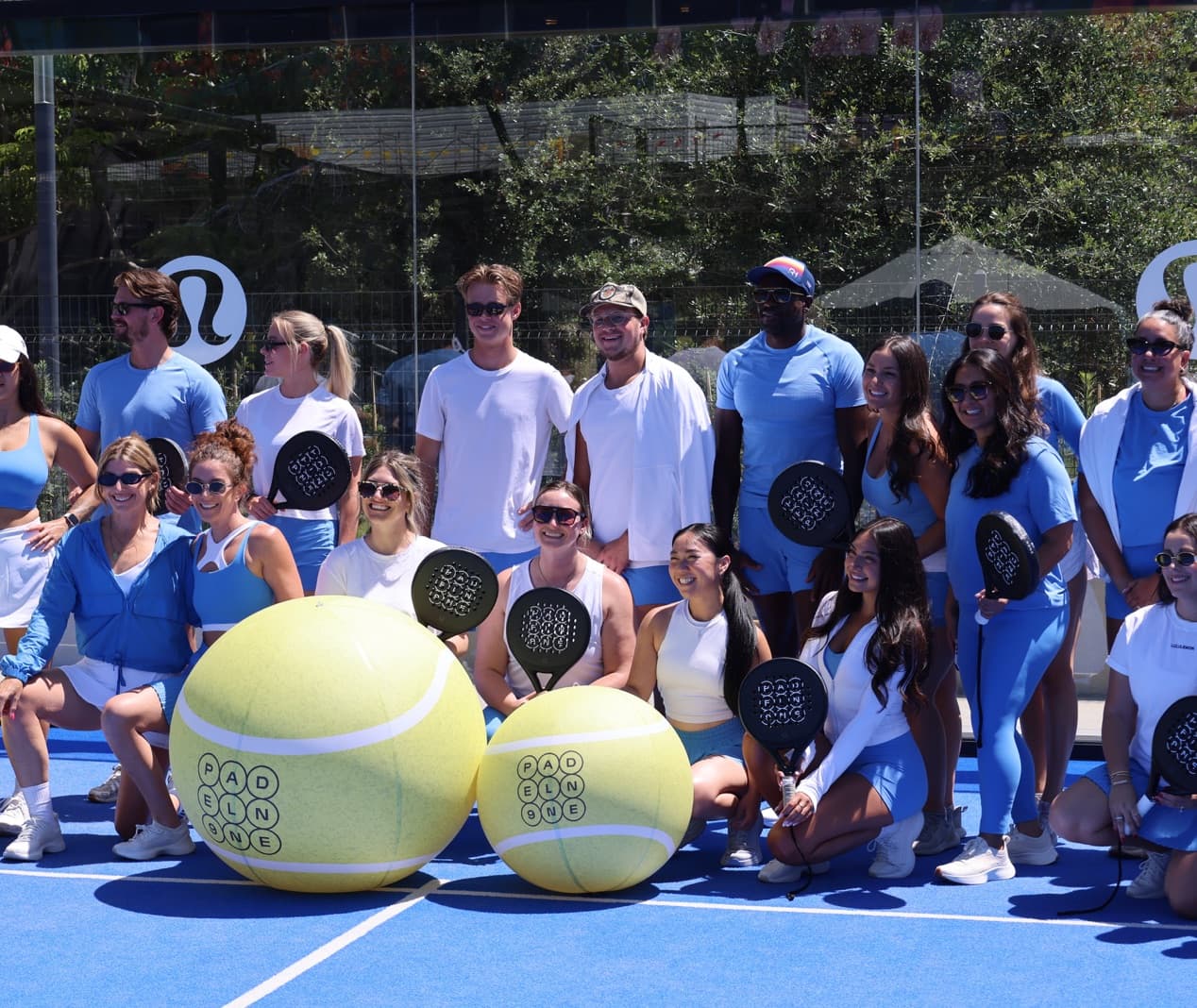 Group photo on a Padel N9ne court